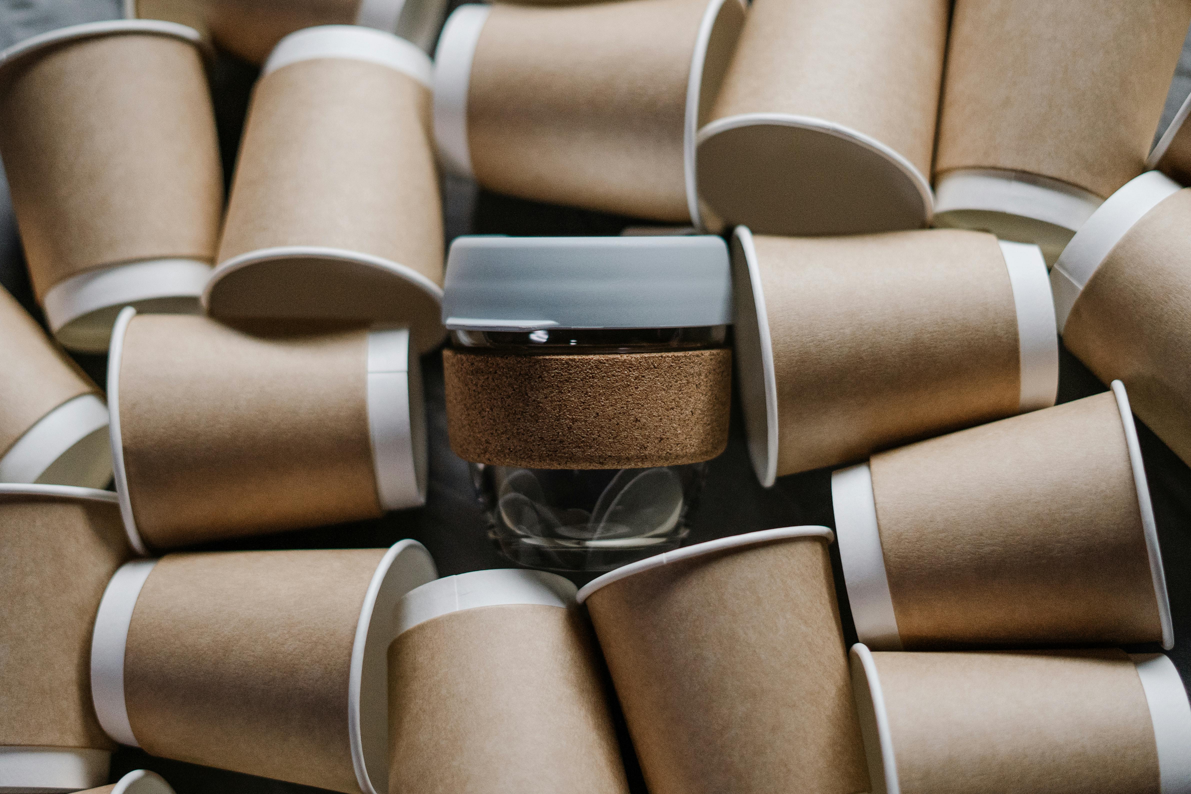 Photo of a reusable cup among disposable cups