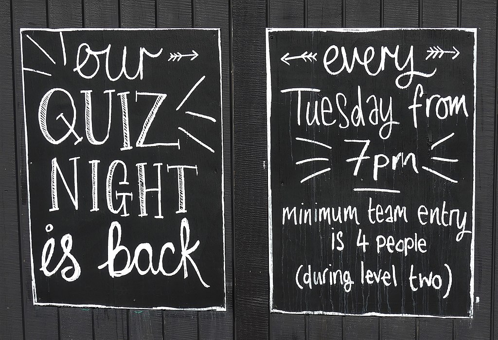 chalkboard advertising a pub quiz every tuesday at 7pm
