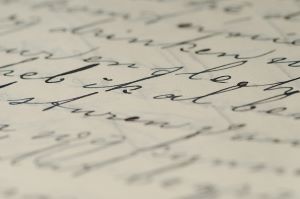 a page with cursive script written in blue ink 