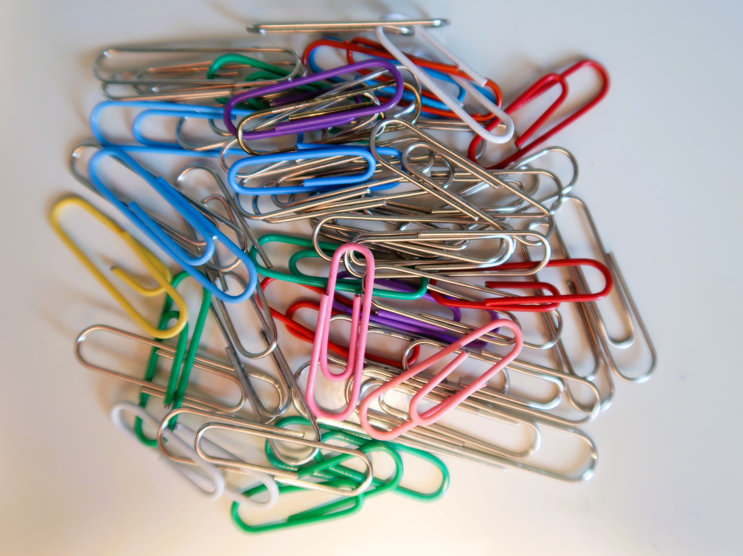 Close up photo of coloured paperclips