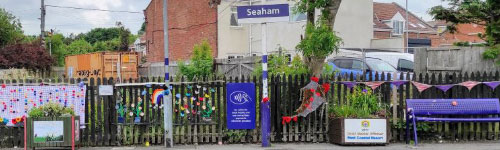 a railway station covered in knitted displays