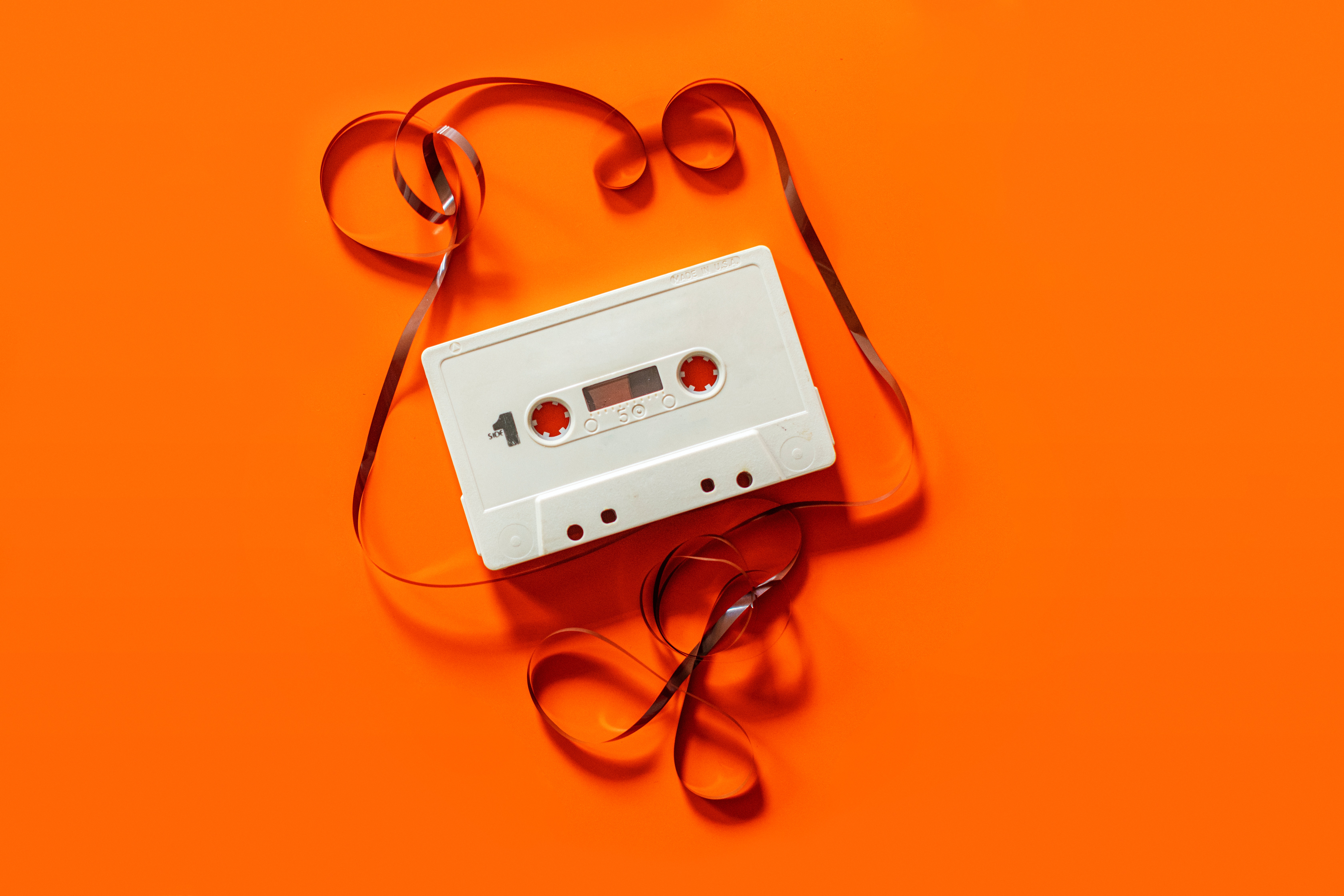 orange background with a white tape on