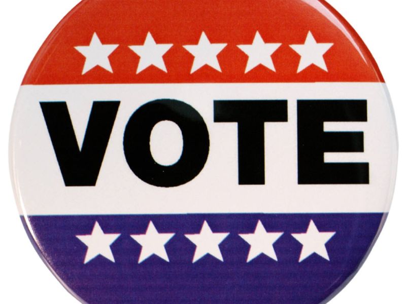 logo saying vote with red and blue, with white stars overlayed.