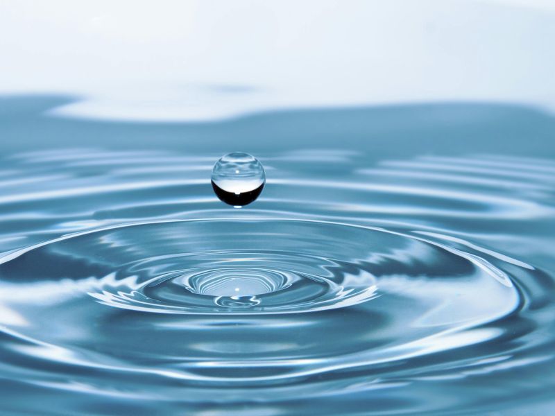 a droplet of water falling on a surface